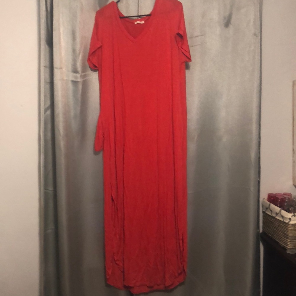 Coral maxi dress with the bottom sides split.